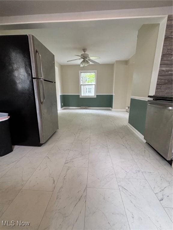4721 Ardmore Ave, Cleveland, OH 44144 - kitchen featuring freestanding refrigerator, ceiling fan, light marble finish flooring, and baseboards