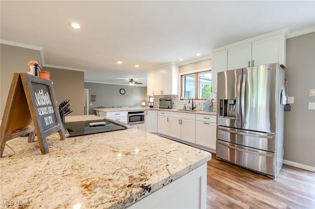 8921 Auburn Rd, Chardon, OH 44024 - kitchen with appliances with stainless steel finishes, crown molding, a sink, recessed lighting, and white cabinetry