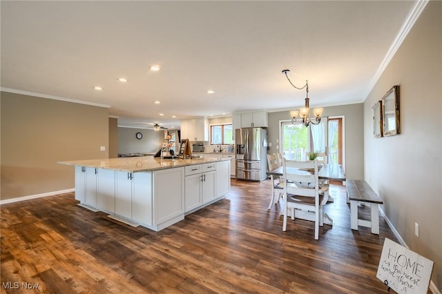 8921 Auburn Rd, Chardon, OH 44024 - kitchen featuring stainless steel refrigerator with ice dispenser, ornamental molding, a center island, recessed lighting, and a chandelier
