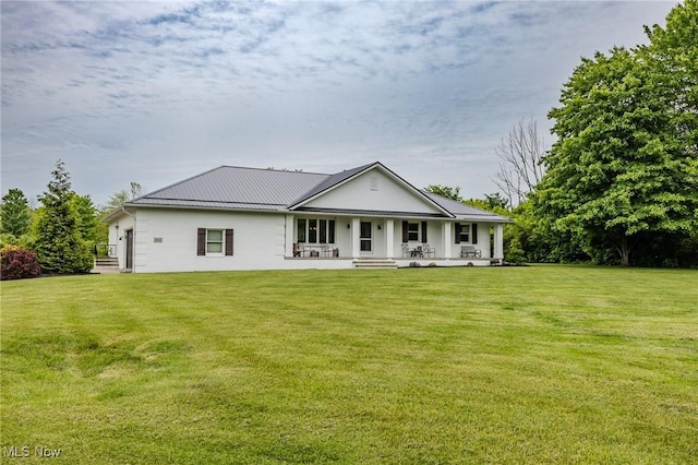 8921 Auburn Rd, Chardon, OH 44024 - back of property with a porch and a lawn