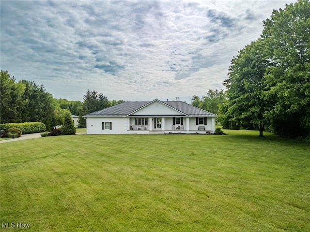 8921 Auburn Rd, Chardon, OH 44024 - view of front facade featuring a porch, a front lawn, and metal roof