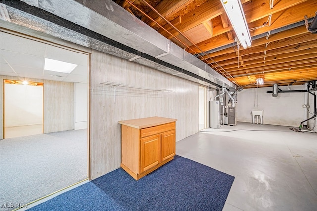7410 Fieldstone Ave, Conneaut, OH 44030 - basement with gas water heater, a sink, and heating unit