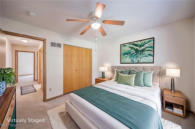 7410 Fieldstone Ave, Conneaut, OH 44030 - bedroom with light carpet, a closet, baseboards, and a ceiling fan