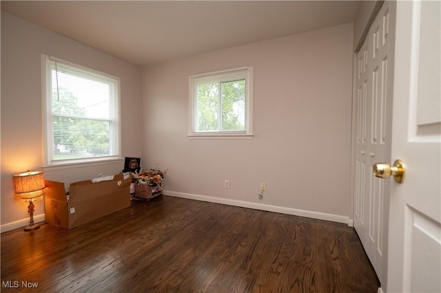 3406 Rebecca Dr, Canfield, OH 44406 - unfurnished bedroom with dark wood-style floors, a closet, and baseboards