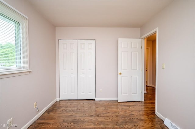 3406 Rebecca Dr, Canfield, OH 44406 - unfurnished bedroom with wood finished floors, a closet, and baseboards