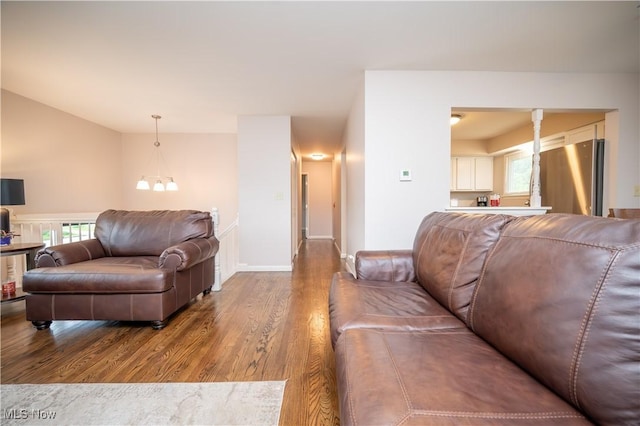3406 Rebecca Dr, Canfield, OH 44406 - living area with wood finished floors, baseboards, and lofted ceiling