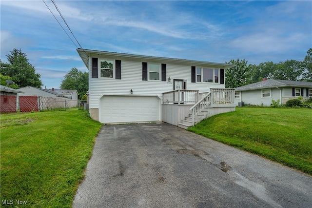 3406 Rebecca Dr, Canfield, OH 44406 - raised ranch with asphalt driveway and an attached garage