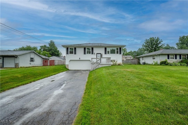 3406 Rebecca Dr, Canfield, OH 44406 - bi-level home with asphalt driveway and an attached garage
