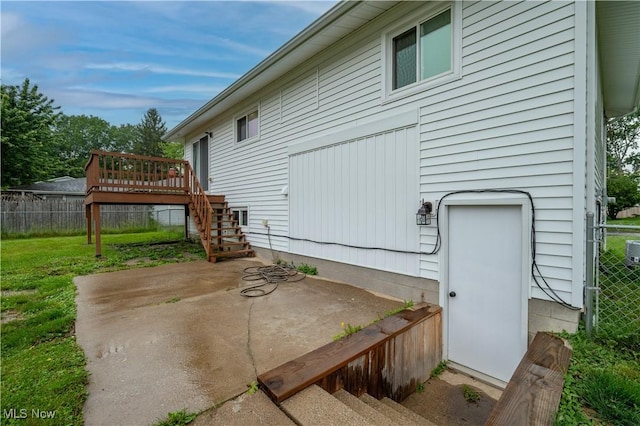 3406 Rebecca Dr, Canfield, OH 44406 - view of side of home with stairs, a deck, and a patio area