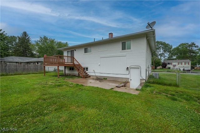 3406 Rebecca Dr, Canfield, OH 44406 - back of property with a wooden deck, a patio area, and a chimney