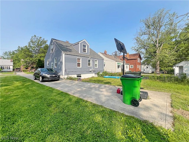 1541 E 196th St, Euclid, OH 44117 - rear view of house featuring a yard and driveway