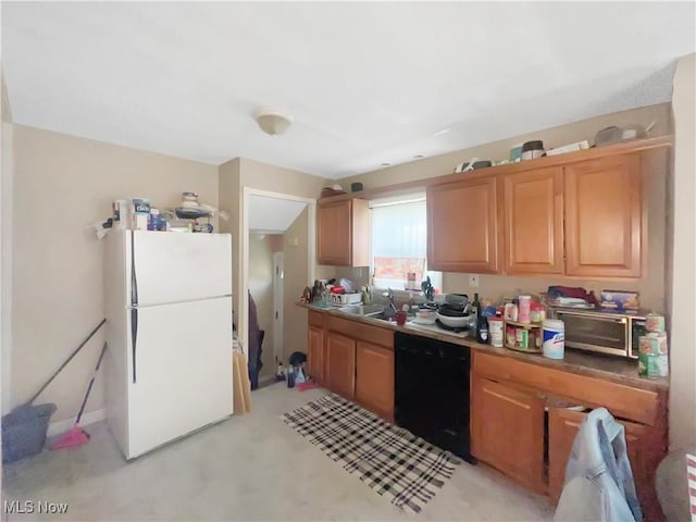 1541 E 196th St, Euclid, OH 44117 - kitchen with freestanding refrigerator, black dishwasher, a sink, and light colored carpet