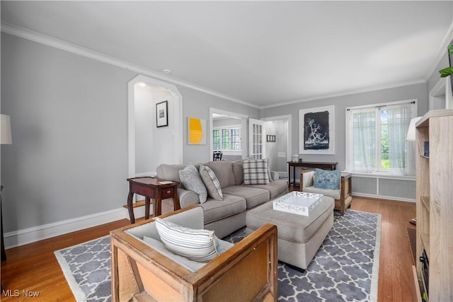 3280 Glencairn Rd, Shaker Heights, OH 44122 - living room featuring wood finished floors, crown molding, arched walkways, and baseboards