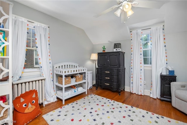 3280 Glencairn Rd, Shaker Heights, OH 44122 - bedroom with radiator heating unit, vaulted ceiling, wood finished floors, baseboards, and ceiling fan