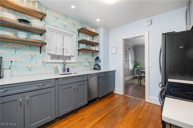 3280 Glencairn Rd, Shaker Heights, OH 44122 - kitchen featuring a sink, open shelves, stainless steel appliances, gray cabinets, and recessed lighting