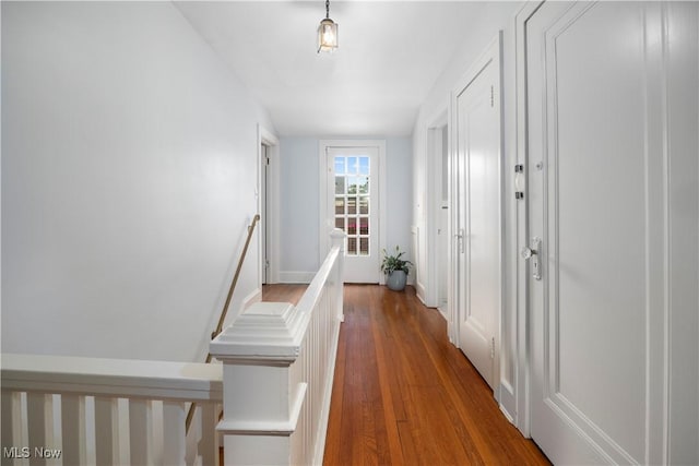 3280 Glencairn Rd, Shaker Heights, OH 44122 - hallway with an upstairs landing, wood finished floors, and baseboards