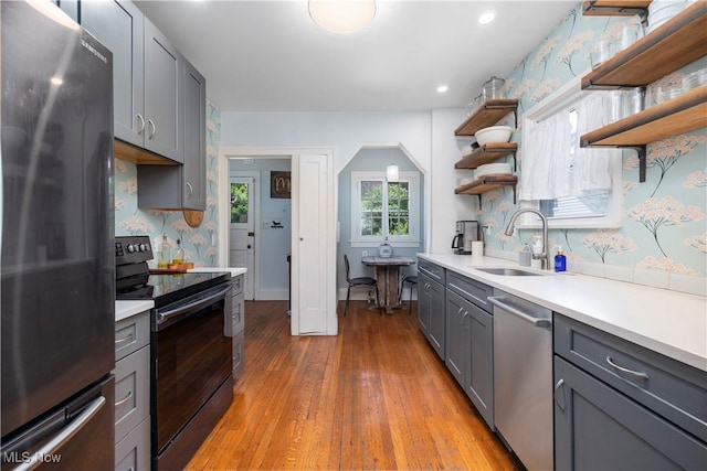 3280 Glencairn Rd, Shaker Heights, OH 44122 - kitchen featuring stainless steel appliances, a sink, gray cabinetry, open shelves, and light countertops