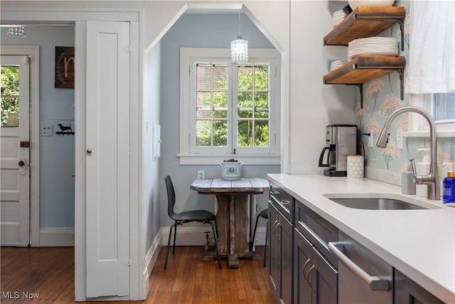3280 Glencairn Rd, Shaker Heights, OH 44122 - kitchen featuring open shelves, hardwood / wood-style flooring, dishwasher, a chandelier, and plenty of natural light