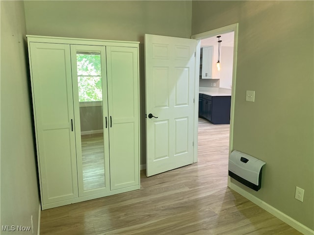 4244 Hensel Dr SW, Carrollton, OH 44615 - unfurnished bedroom featuring baseboards, light wood-style floors, and a closet