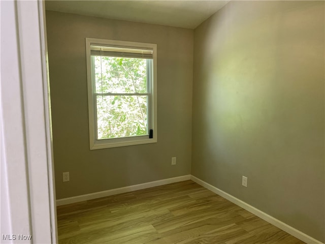 4244 Hensel Dr SW, Carrollton, OH 44615 - empty room with wood finished floors and baseboards