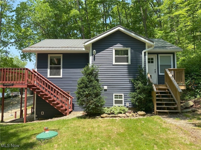 4244 Hensel Dr SW, Carrollton, OH 44615 - rear view of property featuring stairway, a wooden deck, and a yard