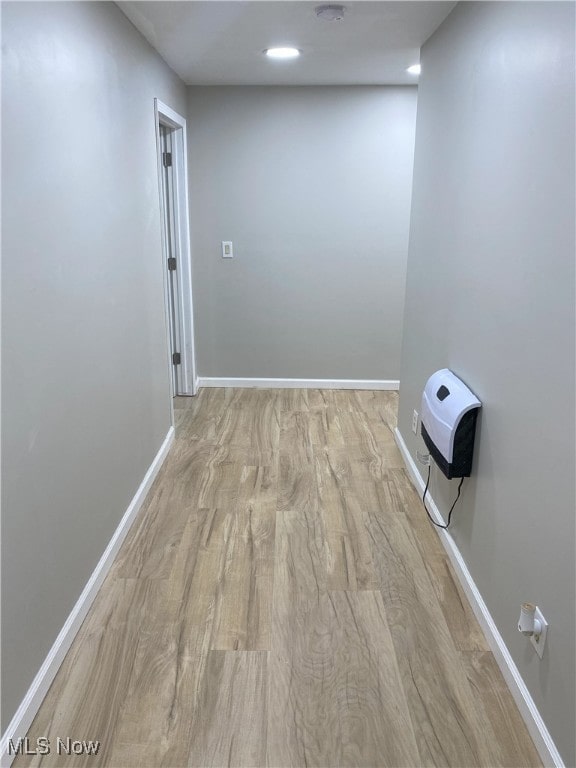4244 Hensel Dr SW, Carrollton, OH 44615 - unfurnished room featuring wood finished floors, baseboards, and heating unit