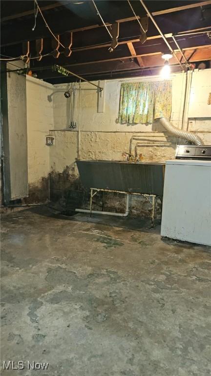 10612 Linnet Ave, Cleveland, OH 44111 - unfinished basement featuring washer / dryer