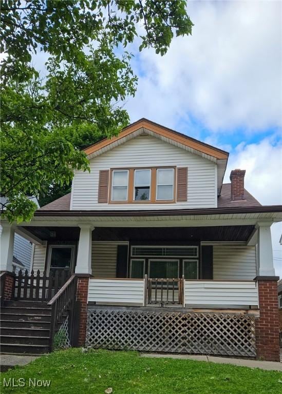 10612 Linnet Ave, Cleveland, OH 44111 - back of property with a porch and a chimney