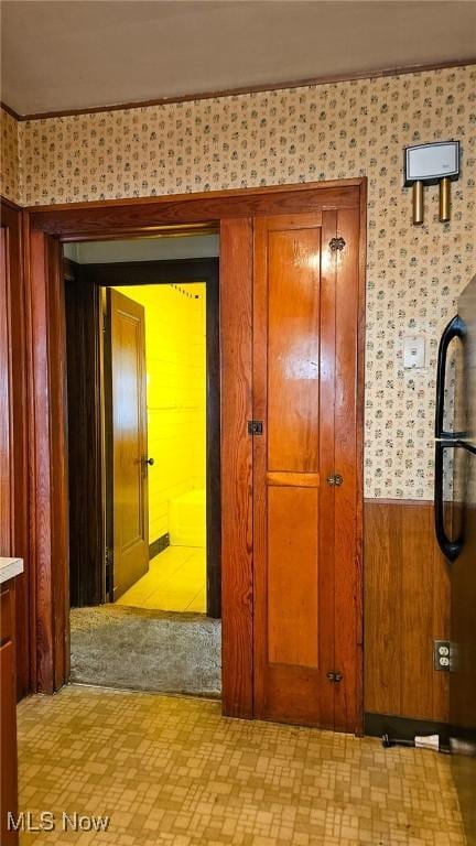 10612 Linnet Ave, Cleveland, OH 44111 - hallway with wallpapered walls and light flooring