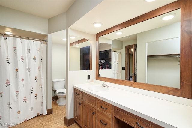 200 Granger Rd, Medina, OH 44256 - full bath featuring toilet, vanity, a shower with curtain, and recessed lighting