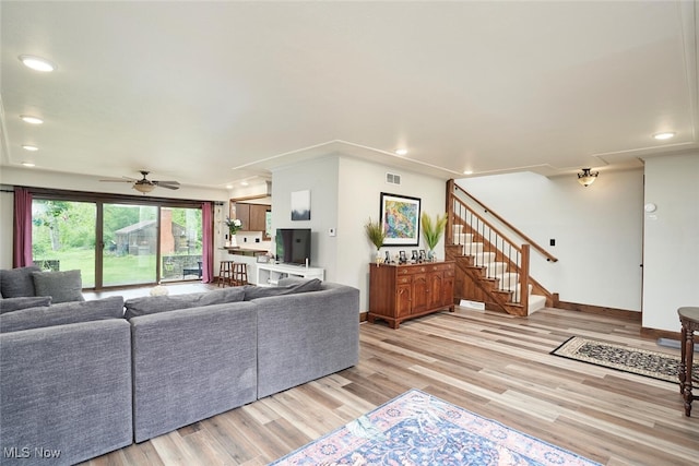 200 Granger Rd, Medina, OH 44256 - living area featuring light wood finished floors, ceiling fan, stairway, recessed lighting, and baseboards