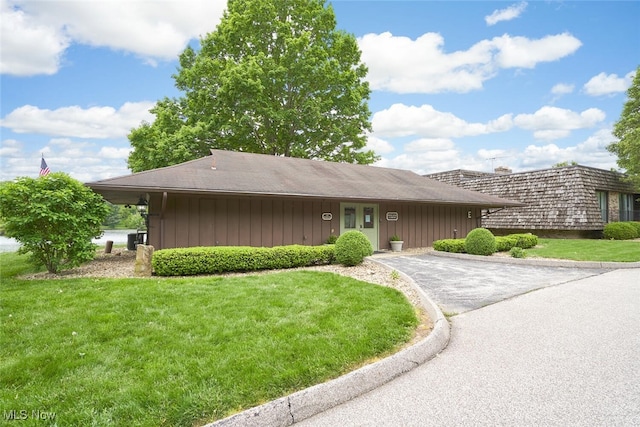 200 Granger Rd, Medina, OH 44256 - view of front of house featuring a front lawn, asphalt driveway, and board and batten siding