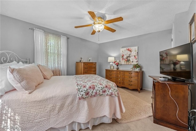 5725 Grove St, Louisville, OH 44641 - bedroom with light colored carpet and ceiling fan