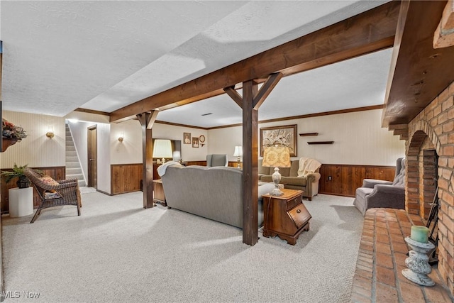 5725 Grove St, Louisville, OH 44641 - living room featuring wainscoting, wooden walls, stairs, carpet, and a textured ceiling