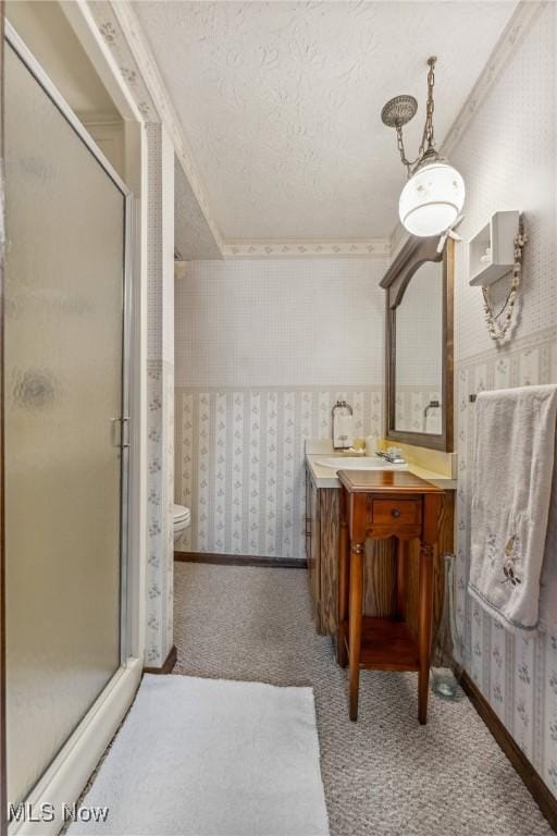 5725 Grove St, Louisville, OH 44641 - full bath featuring wallpapered walls, vanity, a stall shower, toilet, and a textured ceiling