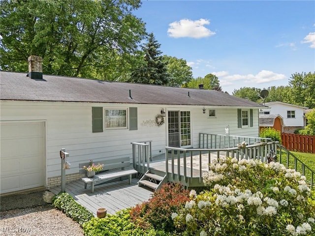 5725 Grove St, Louisville, OH 44641 - rear view of house featuring a wooden deck and roof with shingles