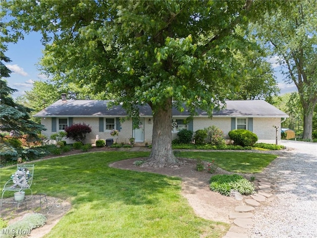 5725 Grove St, Louisville, OH 44641 - single story home featuring brick siding and a front yard