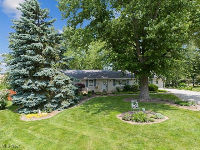 5725 Grove St, Louisville, OH 44641 - view of front of house featuring a front lawn