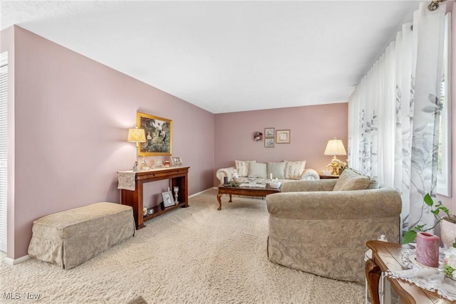 5725 Grove St, Louisville, OH 44641 - living room featuring carpet flooring and baseboards
