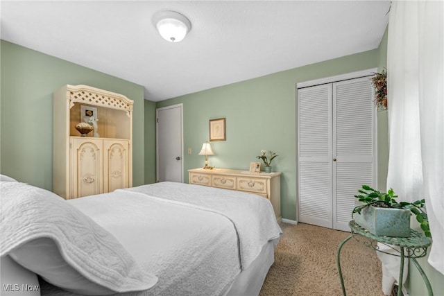 5725 Grove St, Louisville, OH 44641 - bedroom with carpet floors, a closet, and baseboards
