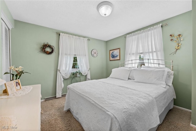 5725 Grove St, Louisville, OH 44641 - bedroom with carpet flooring, baseboards, and a closet