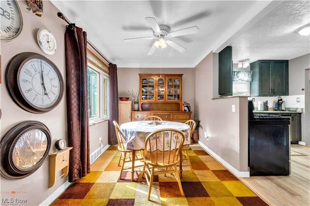 459 Lloyd Rd, Euclid, OH 44132 - dining area with ceiling fan, baseboards, and light floors
