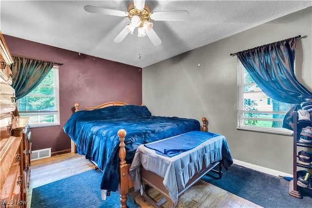 459 Lloyd Rd, Euclid, OH 44132 - bedroom with wood finished floors, baseboards, and ceiling fan