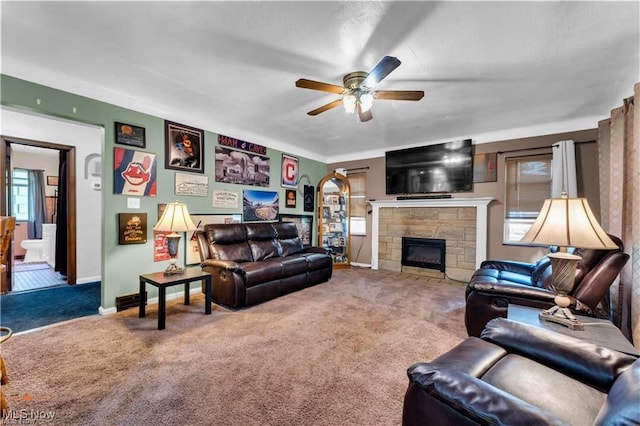 459 Lloyd Rd, Euclid, OH 44132 - carpeted living area featuring a ceiling fan, a fireplace, and baseboards