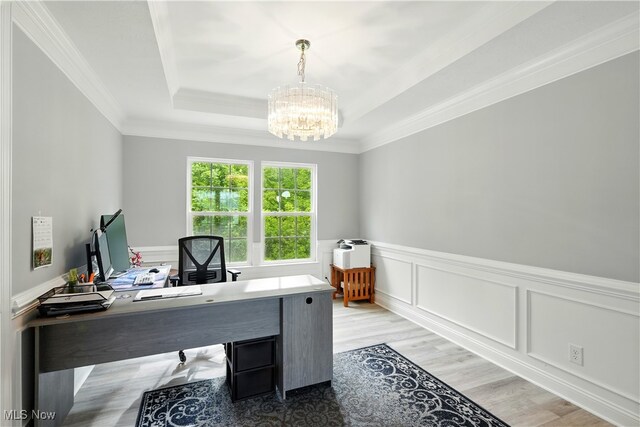 3425 Eryn Pl, Hudson, OH 44236 - office space with a chandelier, a tray ceiling, crown molding, wainscoting, and light wood-style flooring