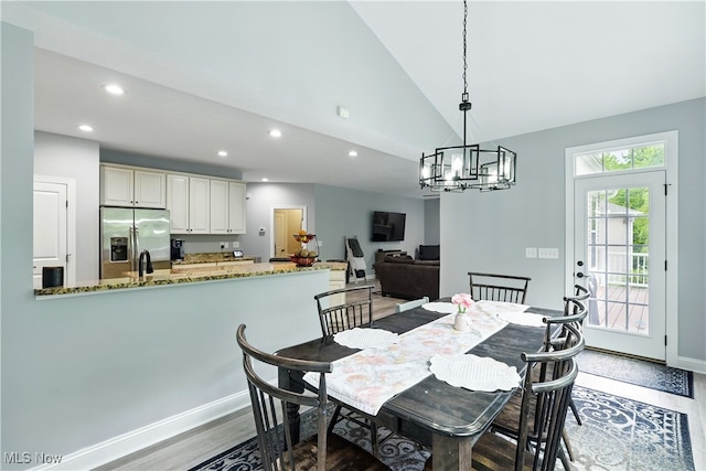 3425 Eryn Pl, Hudson, OH 44236 - dining space featuring wood finished floors, recessed lighting, lofted ceiling, a chandelier, and baseboards