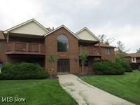 8595 Scenicview Dr Unit S105, Broadview Heights, OH 44147 - view of front of property with a front lawn and a balcony