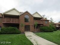 8595 Scenicview Dr Unit S105, Broadview Heights, OH 44147 - view of front of property with a front lawn and a balcony