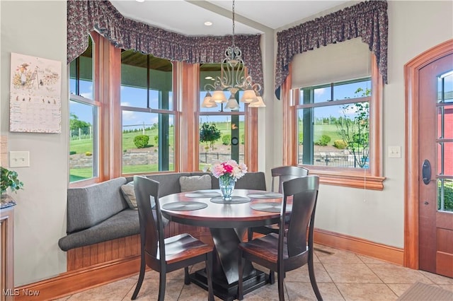 9627 State Route 152, Richmond, OH 43944 - dining room with tile patterned flooring, baseboards, and a chandelier