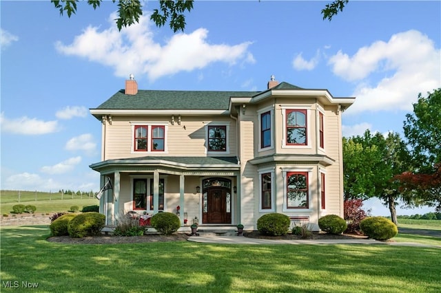 9627 State Route 152, Richmond, OH 43944 - view of front of home featuring a front yard, a porch, and a chimney